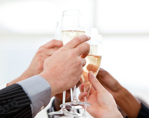 Close-up of businessmen celebrating an event with champagne in the company